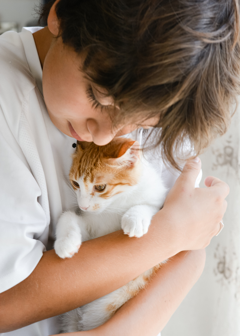 A Person Hugging His Pet